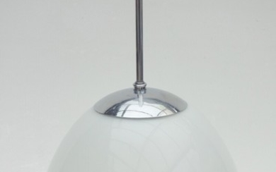 An opal glass bell pendant with chrome-plated metal suspension, bakelite socket. Manufactured by Louis Poulsen. H. 37 cm. Diam. 30 cm.