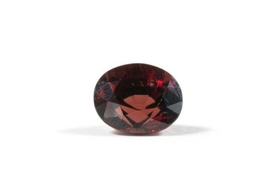 An unmounted red spinel