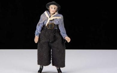 An unusual late 19th century all-bisque sailor doll