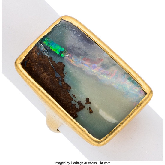 Boulder Opal, Gold Ring, Lilly Fitzgerald The ring centers...