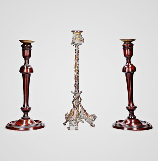 Bronze candlestick decorated with lions and ram heads, and pair of Victorian candlesticks in lathed wood and brass, late 19th Century-early 20th Century.