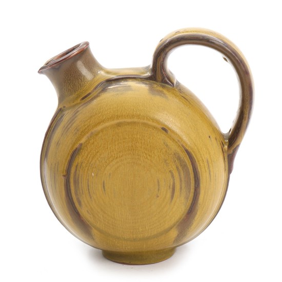 Carl Halier: A Royal Copenhagen stoneware pitcher decorated with green-yellowish glaze. Signed monogram. H. 17 cm.