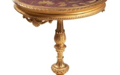 Carved and gilt-wooden coffee tableLigurian manufacture, mid 19th centurywith tripod base, round top with floral embroidery covered with glass h 82 cm, diameter 57 cm