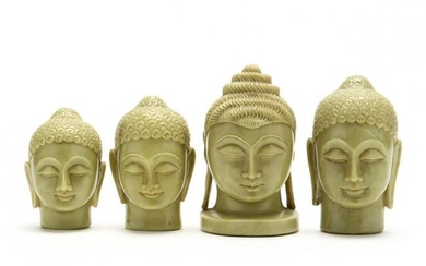 Four Carved Hardstone Buddha Heads