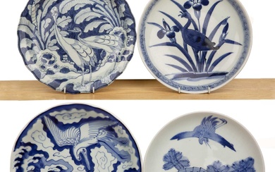 Four blue and white porcelain chargers Japanese variously painted with...