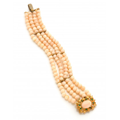 Four strand coral bracelet with yellow gold spacers and clasp, the latter finished with a cabochon coral and small green...