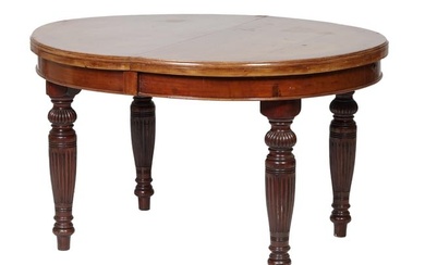 French Napoleon III Walnut Dining Table, late 19th c., the moulded oval top, on ambitious ring