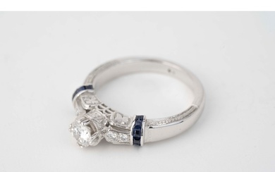 Gold and 0.50ct Diamond Ring A diamond and sapphire ring,...