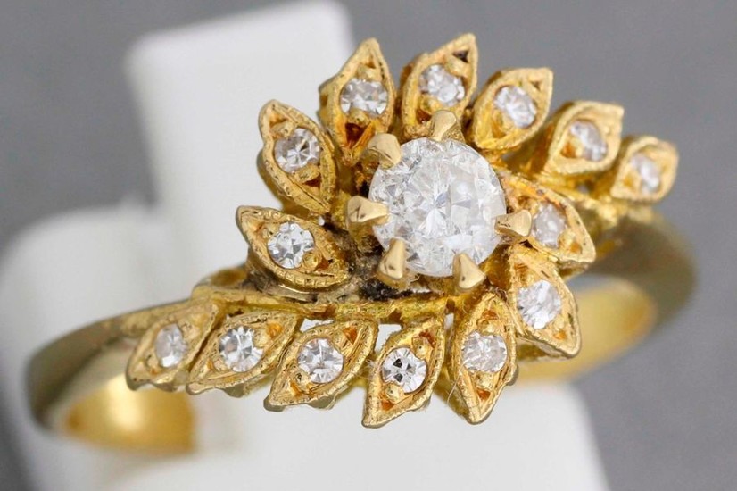 Gold "flower" ring decorated with a central brilliant-cut...
