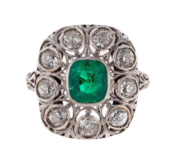 Gold ring decorated with an emerald surrounded by diamonds -...