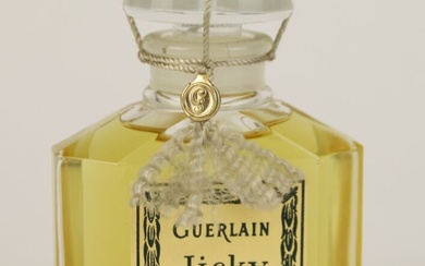 Guerlain - "Jicky" - (1889) Flacon en verre incolore pressé moulé modèle au "bouchon quadrilobé"...