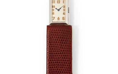 Jaeger-LeCoultre, n° 8825, vers 1930. Une rare montre-pince en acier dissimulée dans son étui en...