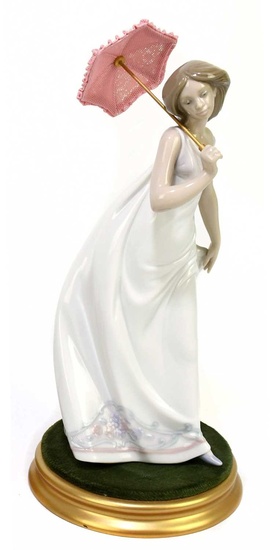 LLADRO; a ceramic figure of a girl with parasol, 7636,...