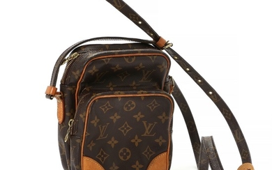 Louis Vuitton: A “Amazone” bag made of brown monogram canvas, brown leather details, a long adjustable strap and two compartments.