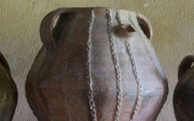 Micaceous pink earthenware oil jug, green glazed inside....