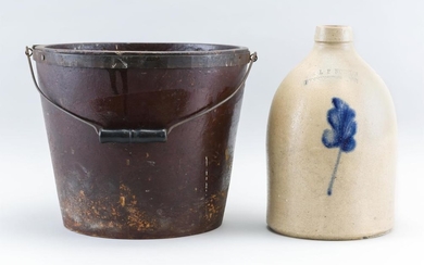 NORTON STONEWARE JUG Together with a red-painted pressed fiberboard fire bucket, height 10". Jug with cobalt blue floral decoration....