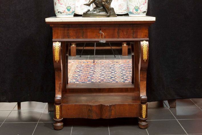 Nineteenth century so-called trumeau : a console with drawer in acajou decorated with decorated bronze fittings, with mirror back and white marble top - ca 1825 |||19th Cent. console/bracket with drawer in mahogany with mountings in guilded bronze
