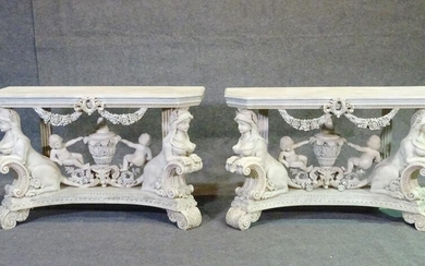 PAIR OF ROCCO STYLE DISTRESSED FIGURAL CONSOLES