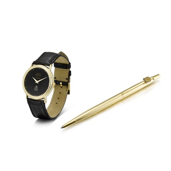 PIAGET | REFERENCE 12332 A YELLOW GOLD WRISTWATCH WITH HAWK OF QURAYSH DIAL AND A GOLD PLATED BALL POINT PEN, CIRCA 1990