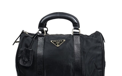 Prada A “Boston” bag of black nylon with black leather trimmings, gold...