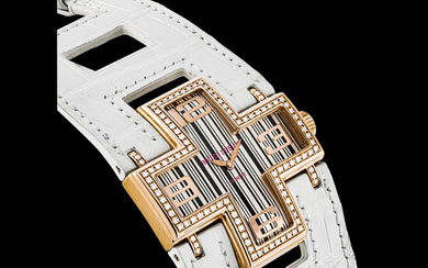 ROGER DUBUIS. A LADY’S 18K PINK GOLD AND DIAMOND-SET LIMITED EDITION CROSS-SHAPED WRISTWATCH FOLLOW ME MODEL, CIRCA 2009