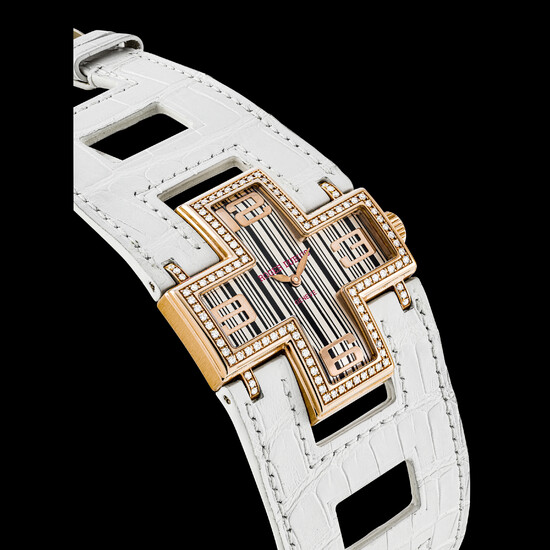 ROGER DUBUIS. A LADY’S 18K PINK GOLD AND DIAMOND-SET LIMITED EDITION CROSS-SHAPED WRISTWATCH FOLLOW ME MODEL, CIRCA 2009