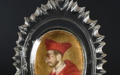 Reliquary in a radiant rock crystal medallion with a portrait in profile on the left, possibly Blessed Pope Innocent XI (1611-1689), miniature in gouache and gold on wove paper (oval 4.3 x 3.4 cm), on the reverse side four relics in inscribed paper:...