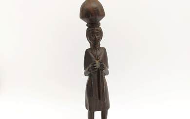 SOUTH AMERICAN SCULPTURE: HAND-CARVED WOODEN WATER-BEARER WITH CHILD.