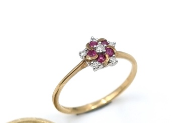Star Lot : A pretty diamond and ruby gold ring. Diamond stam...