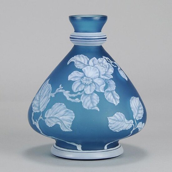 Stevens & Williams English cameo glass vase decorated with a crisp white cameo cut floral pattern against a blue field, signed with impressed mark to base for Stevens and Williams. Circa 1900. Height 20 cm.