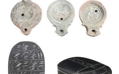 THREE ROMAN TERRACOTTA OIL LAMPS AND AN EGYPTIAN BASALT SCARAB