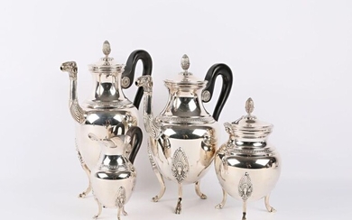 Tea and coffee service in silvery metal including a teapot, a coffee pot, a sugar bowl and a milk jug, it rests on three arched feet ending with lion claws and surmounted by palmettes, the plain baluster belly, the shoulder hemmed with a frieze of...