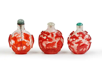 Three Chinese red overlay translucent and snowstorm glass snuff bottles Qing dynasty,...