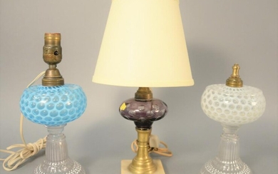 Three glass oil lamps to include blue opalescent glass