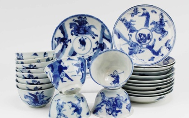 Twelve blue and white cups and saucers with figures