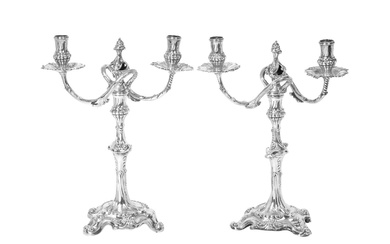 Two George III Silver Two-Light Candleabra One Base by Ebenezer Coker, London, 1760, The Other Base and Branches by Louis Black, London, 1761
