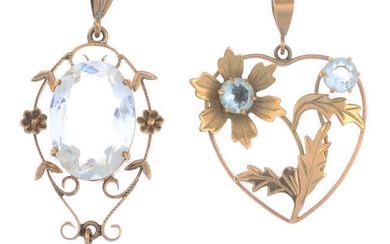 Two aquamarine floral pendants.