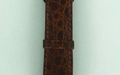 Watchband Turler in 750°/°° gold, round case, manual movement, crocodile strap and gold-plated pin buckle, Circa 1950, Gross weight: 38,64g