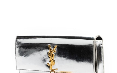 Yves Saint Laurent: A "Kate Tassel Clutch" made of silver coloured patent leather with gold tone hardware, tassel and one compartment. – Bruun Rasmussen Auctioneers of Fine Art