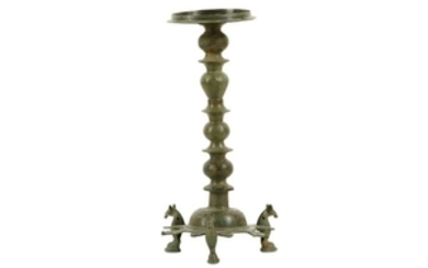 A BRONZE THREE-FOOTED OIL LAMP STAND Iran, 10th - 12th