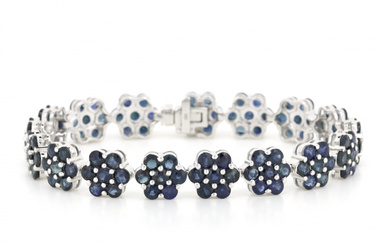14K White Gold and Blue Sapphire, Floral Design Bracelet. The...