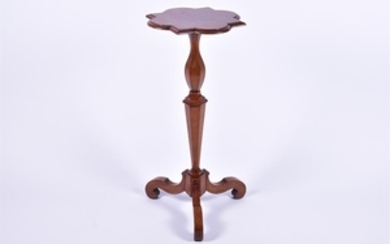A 17th century style walnut tripod table the shaped top on a tapering turned and cut hexagonal stem, above three swept...