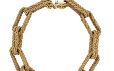 An 18ct gold bracelet, of rope textured...