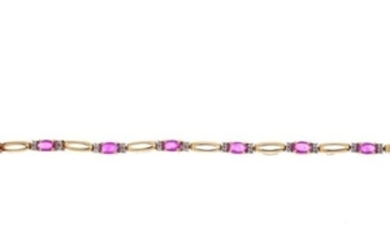 A 9ct gold ruby and diamond bracelet. Designed as a