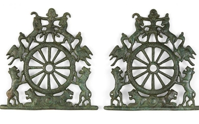 A pair of bronze horse-bits depicting the...