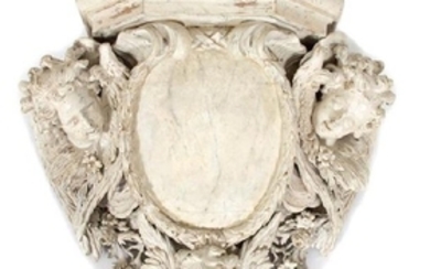 A Continental Carved and White Painted Armorial Wall