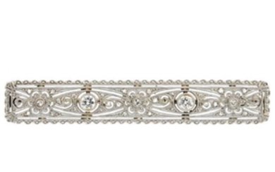 An early 20th century gold diamond brooch. Of openwork