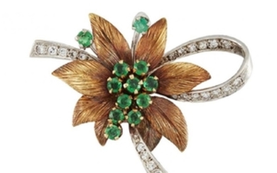 An emerald and diamond brooch, the central...