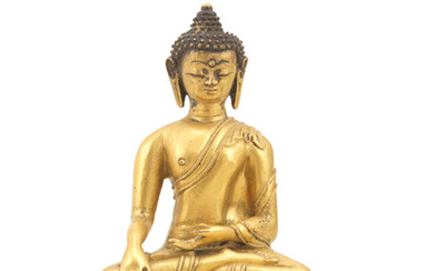 A gilt-bronze figure of Buddha Akshobhya