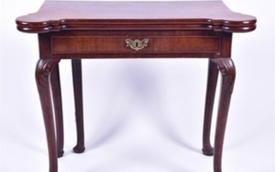 A Queen Anne mahogany card table with solid mahogany shaped top with rounded corners, opening to reveal a mahogany surface,...